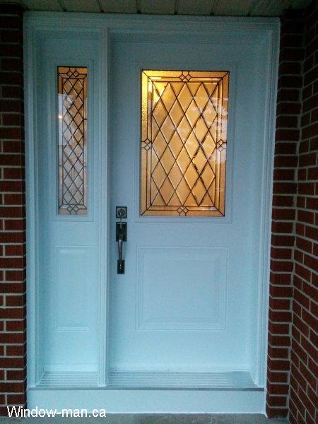 Front door replacement. Single entry steel insulated white and sidelight. Half glass. Cookstown Classic stained glass collection. Installed